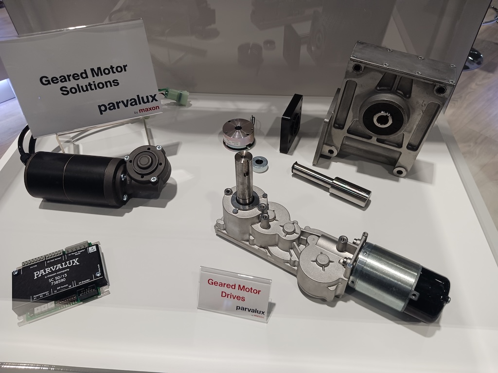 Figure 1: Geared Motor Solutions from parvalux by maxon enables many industrial motion control designs; online configurator software helps with product integration and specification. Geared motors change the speed and torque of motors to fit application needs. Various component combinations of gears, motors, drives and shafts are show in this display at Automate 2024 event by A3, the Association for Advancing Automation, in Chicago. 